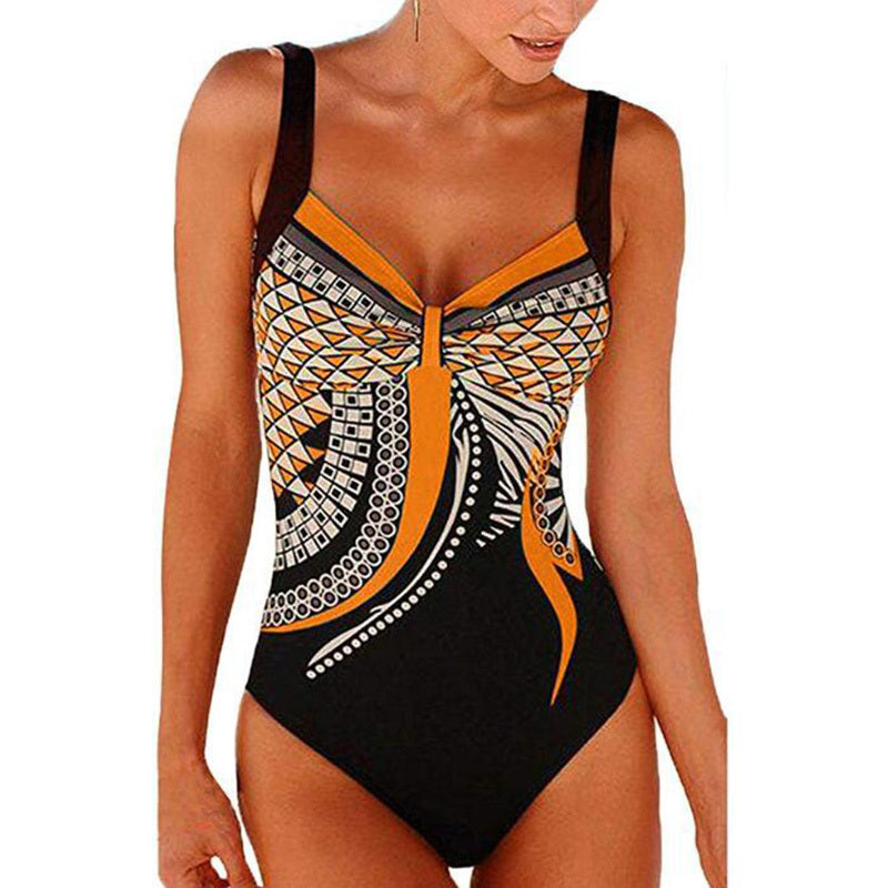One-piece swimsuit with black, orange, and white pattern on a white background