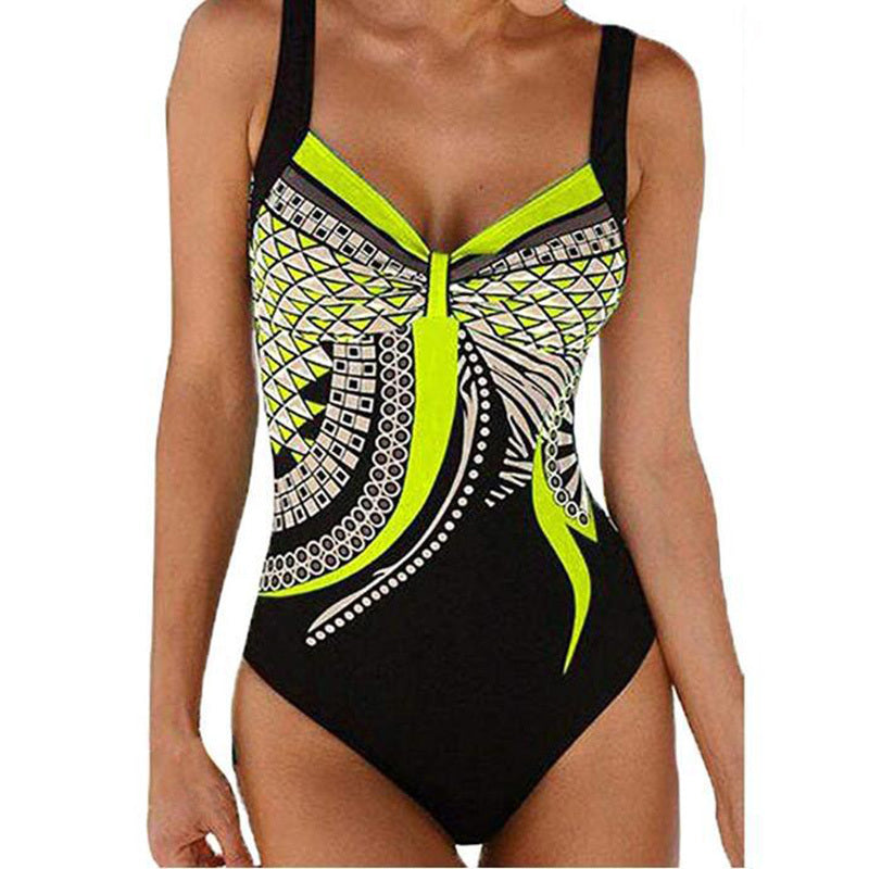 Black swimsuit with neon green and white pattern on a white background