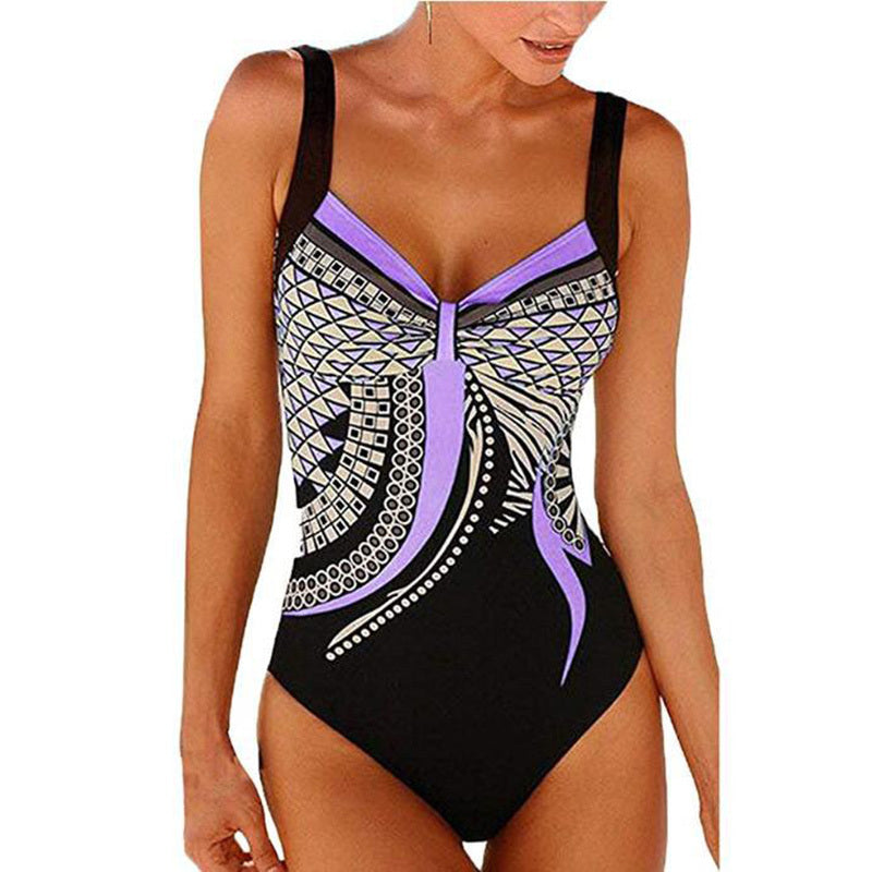 Black swimsuit with purple and white patterns on a white background