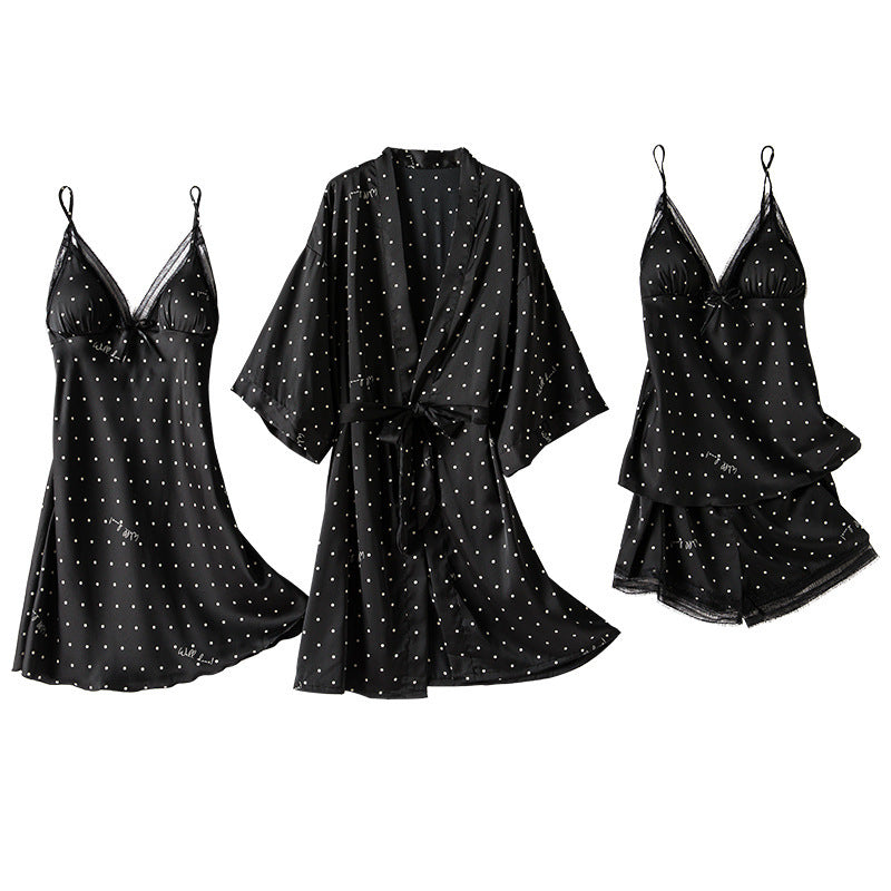 Black satin robe and two black satin nightgowns with star patterns on a white background