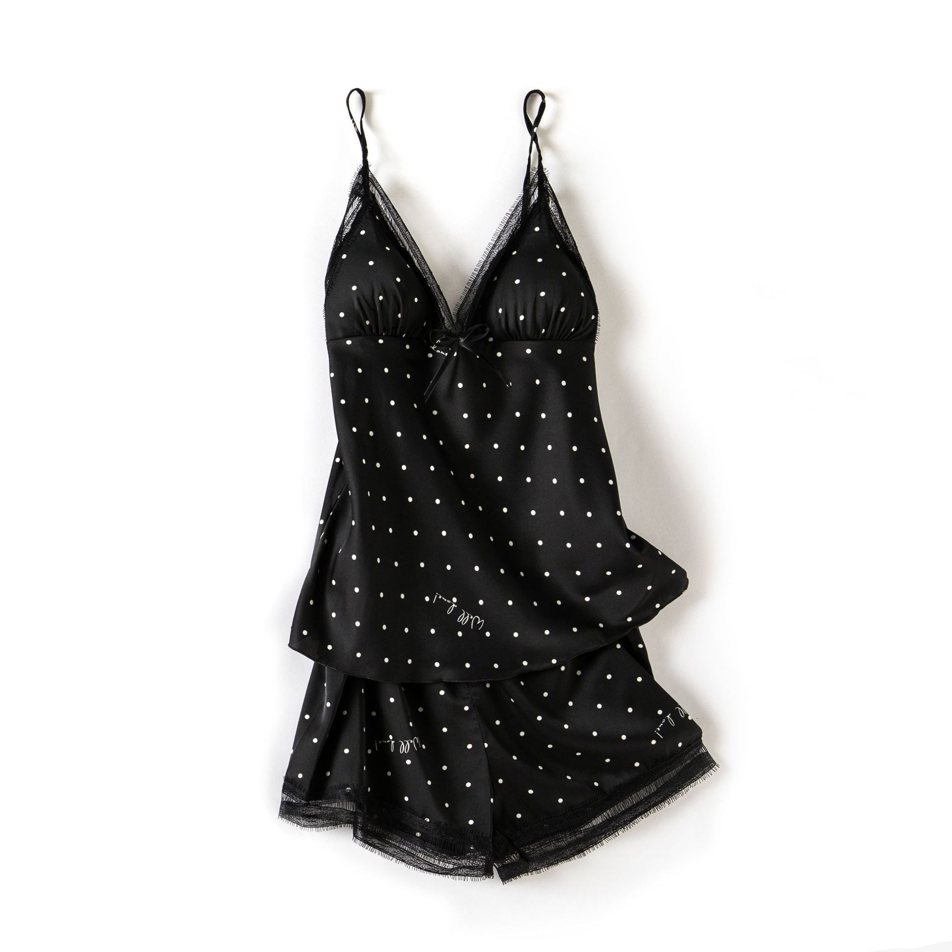 Black polka dot lingerie set on a white background