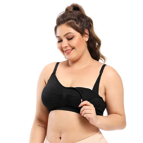 Woman wearing a black bralette on a white background