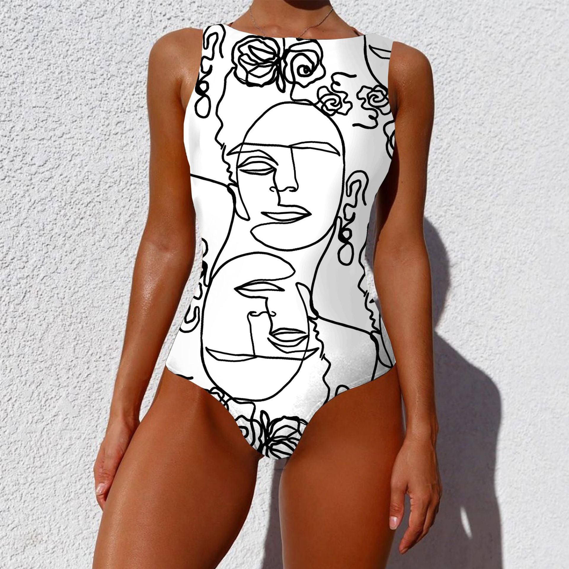 Person wearing a white swimsuit with black line art design against a white background