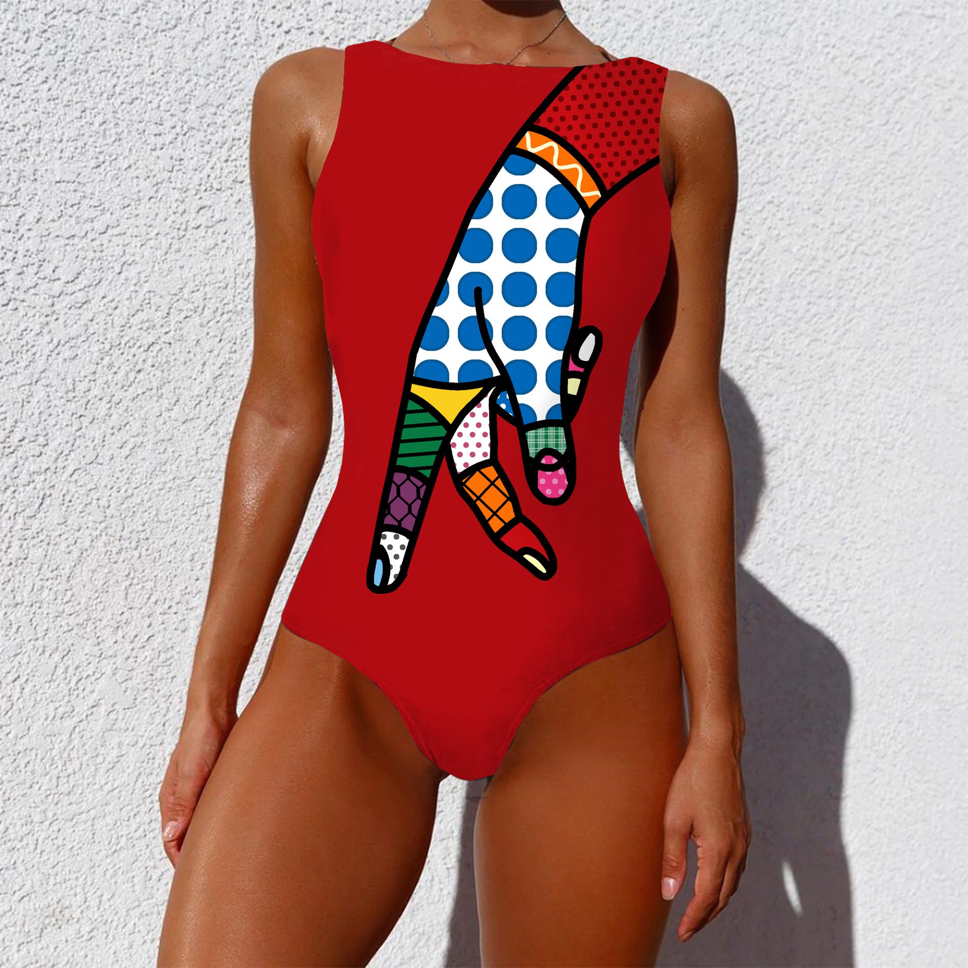 Red swimsuit with colorful abstract design on a white background