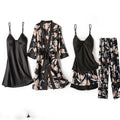 Floral and black satin pajama set on a white background