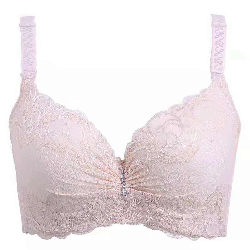 Pink lace bra on a white background