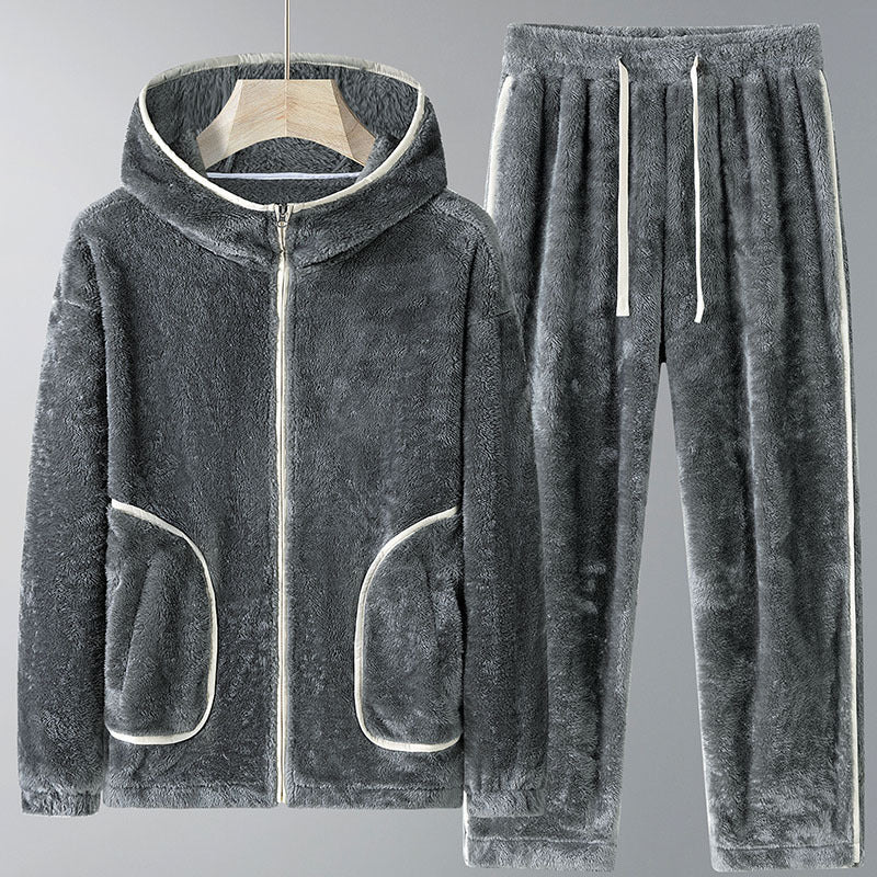 Gray fleece hoodie and pants set on a gray background