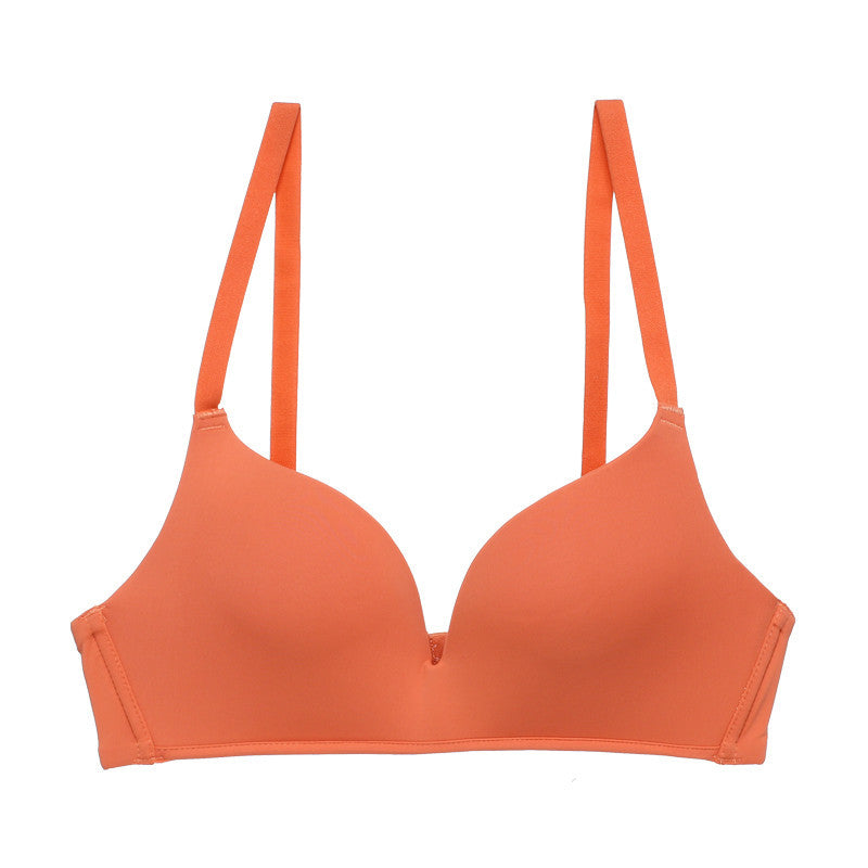 Orange bralette with thin straps on a white background