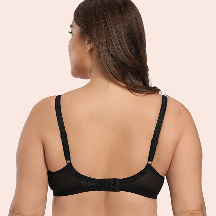 Black bra worn by a model on a beige background