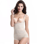 Woman wearing a beige bodysuit on a white background