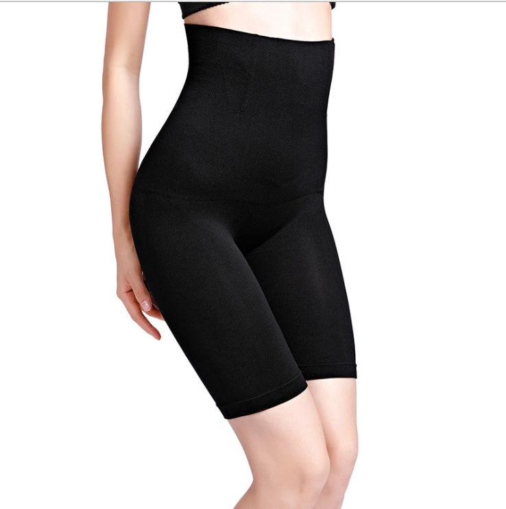 Black high-waisted shapewear shorts on a white background