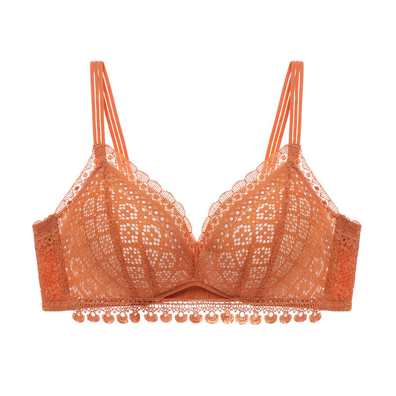 Orange lace bra on a white background