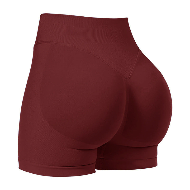 Maroon athletic shorts on a white background