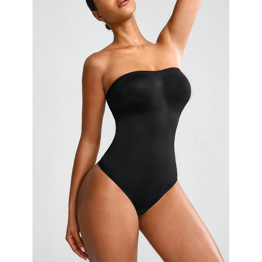 Black strapless bodysuit worn by a model on a light gray background