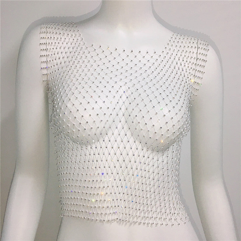 Mannequin wearing a white beaded top against a plain background
