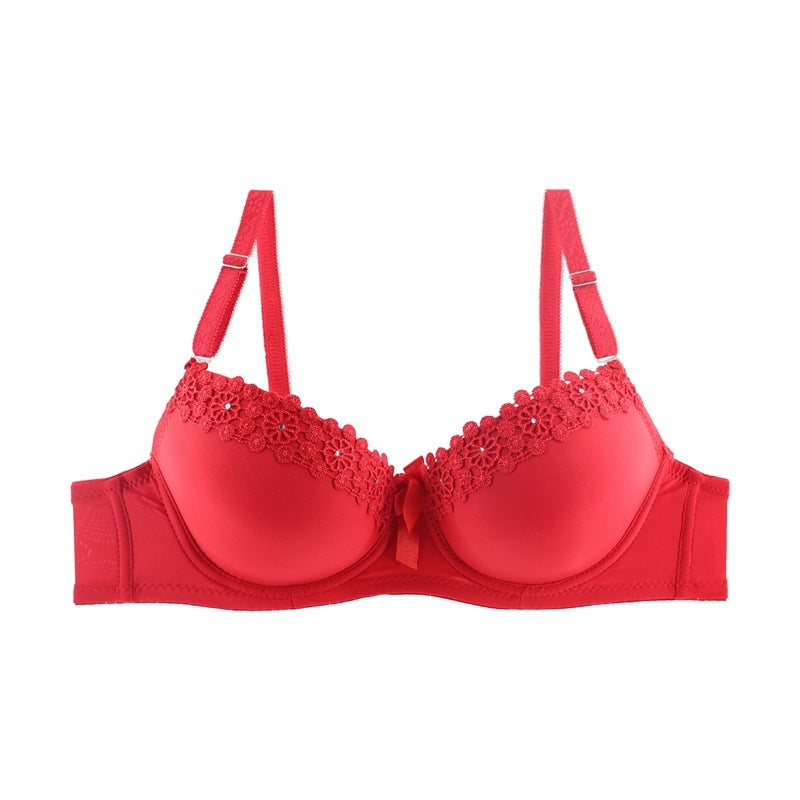 Red bra with lace details on a white background