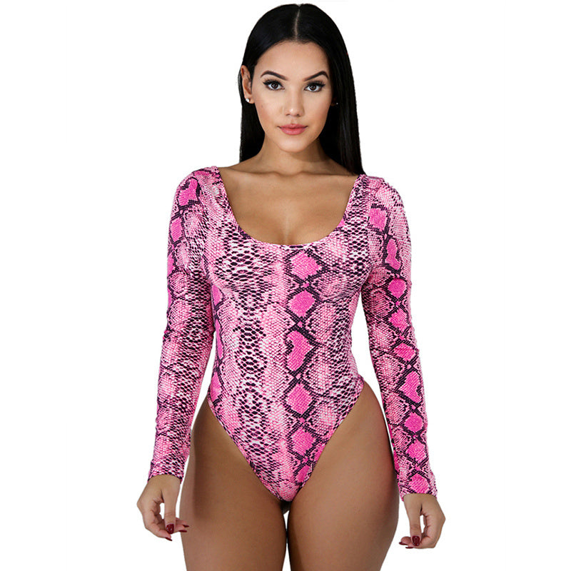 Woman wearing a pink snake print bodysuit on a white background