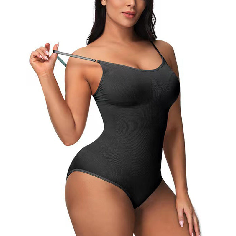 Woman wearing a black bodysuit on a white background
