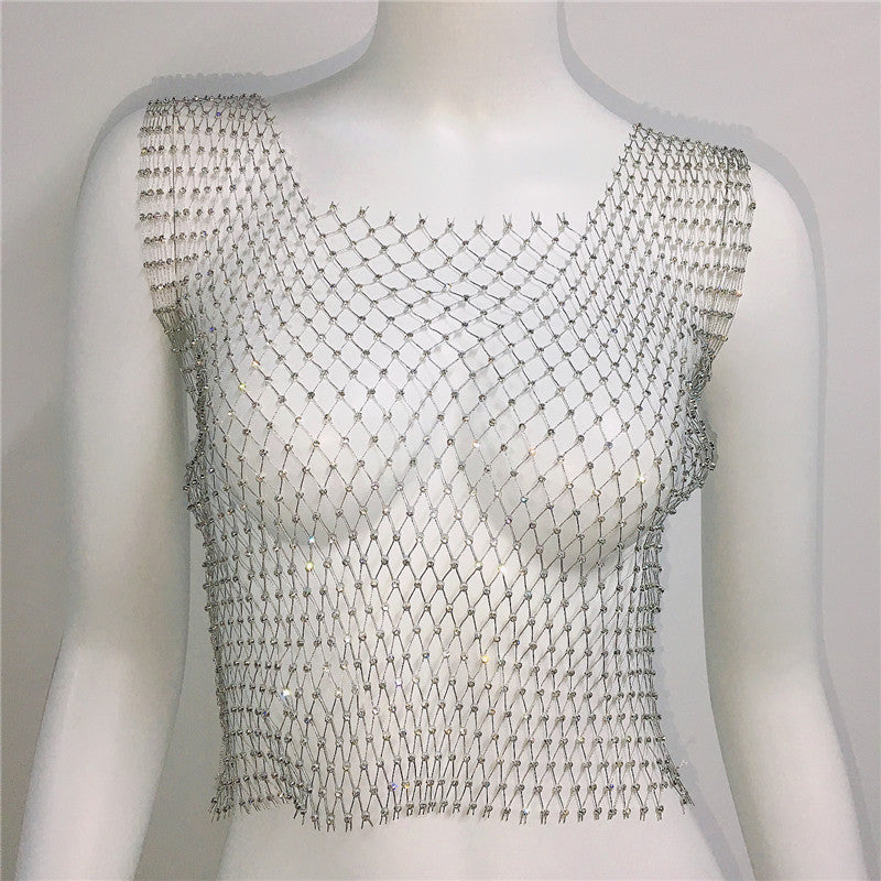 Mannequin wearing a silver chainmail vest on a plain background