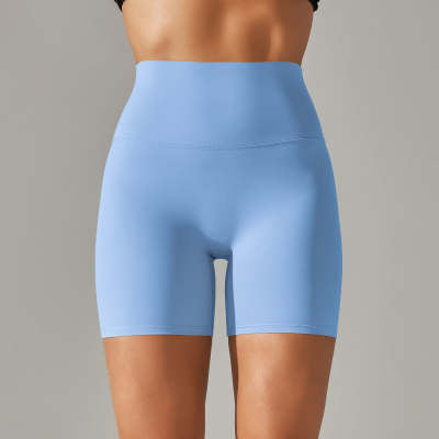 Light blue athletic shorts worn by a person on a gray background