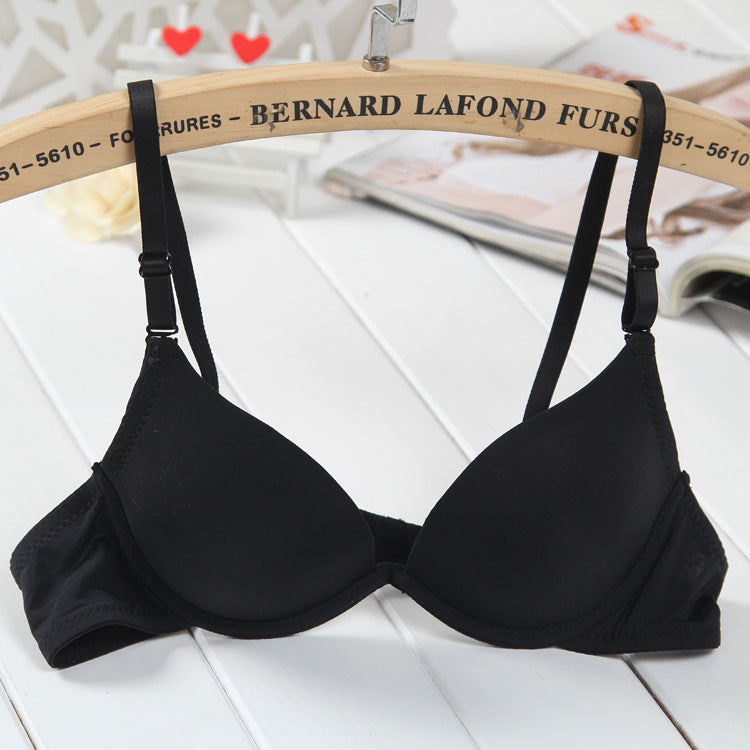 Black bra on a hanger with 'Bernard Lafond Furs' branding.