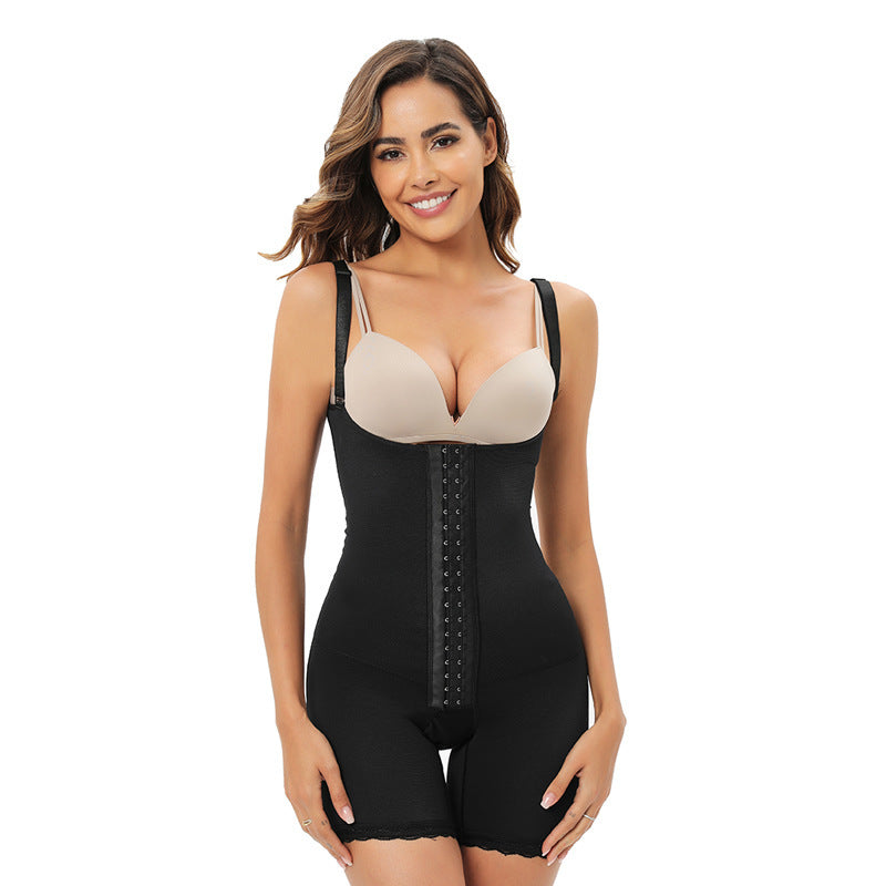 Woman wearing a black shapewear garment on a white background