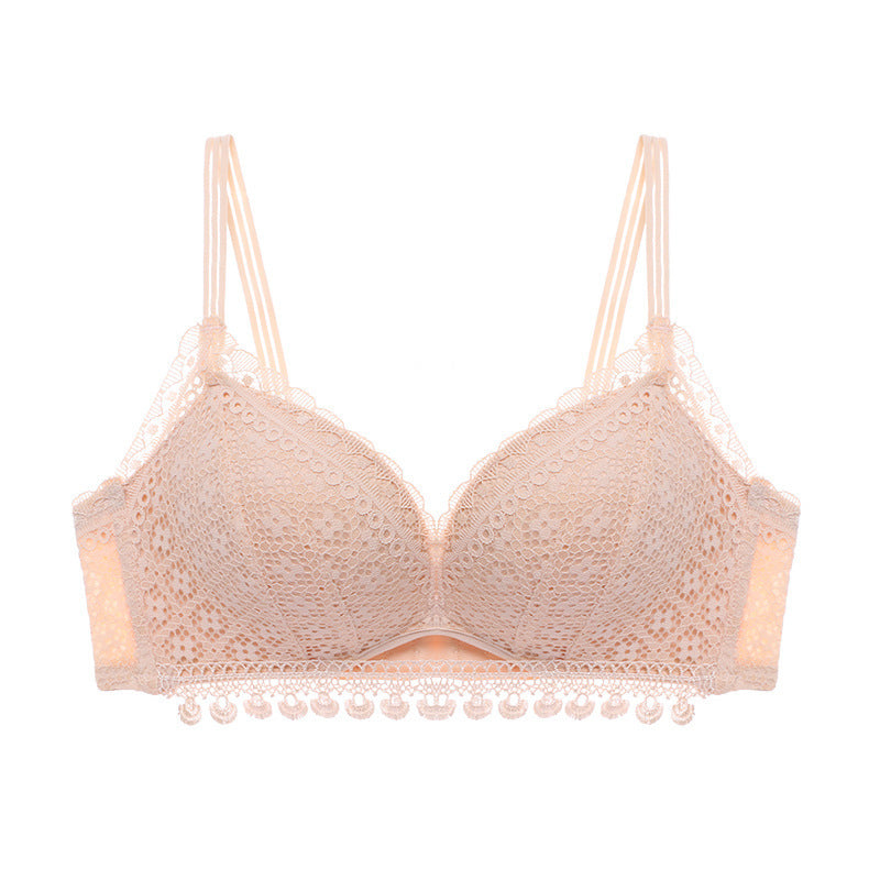 Beige lace bra on a white background