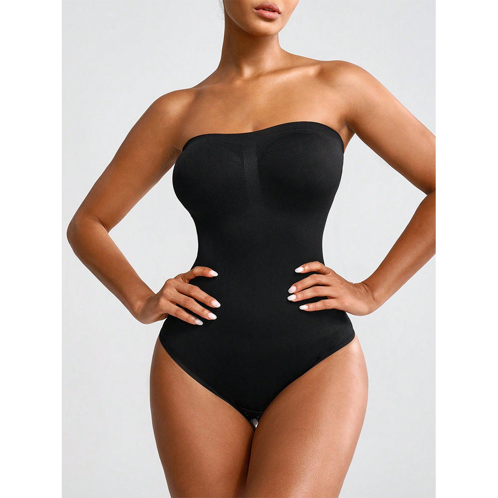 Black strapless bodysuit worn by a model on a light gray background