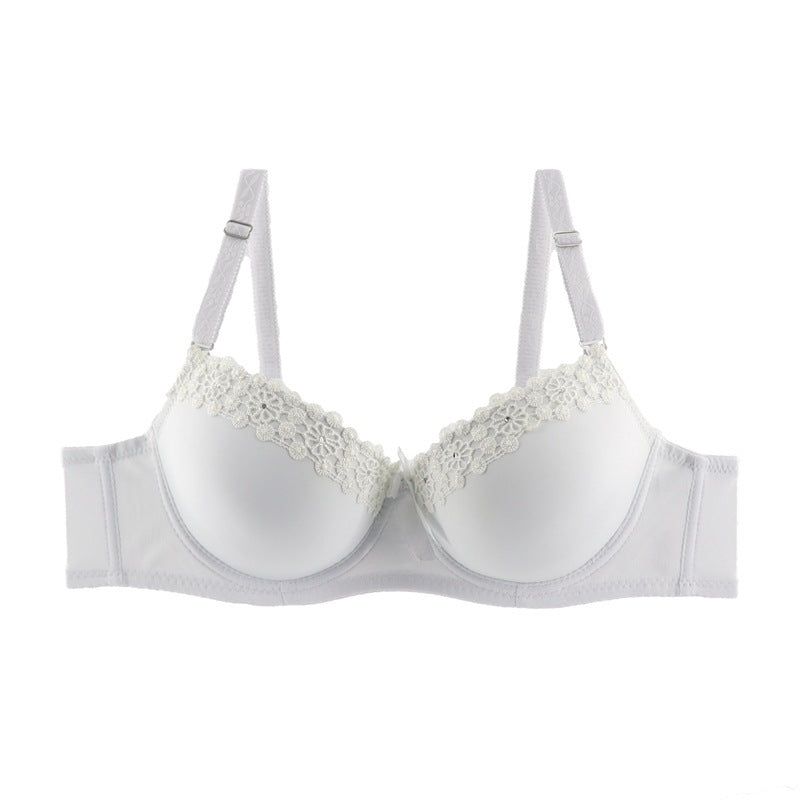White bra with floral lace details on a white background