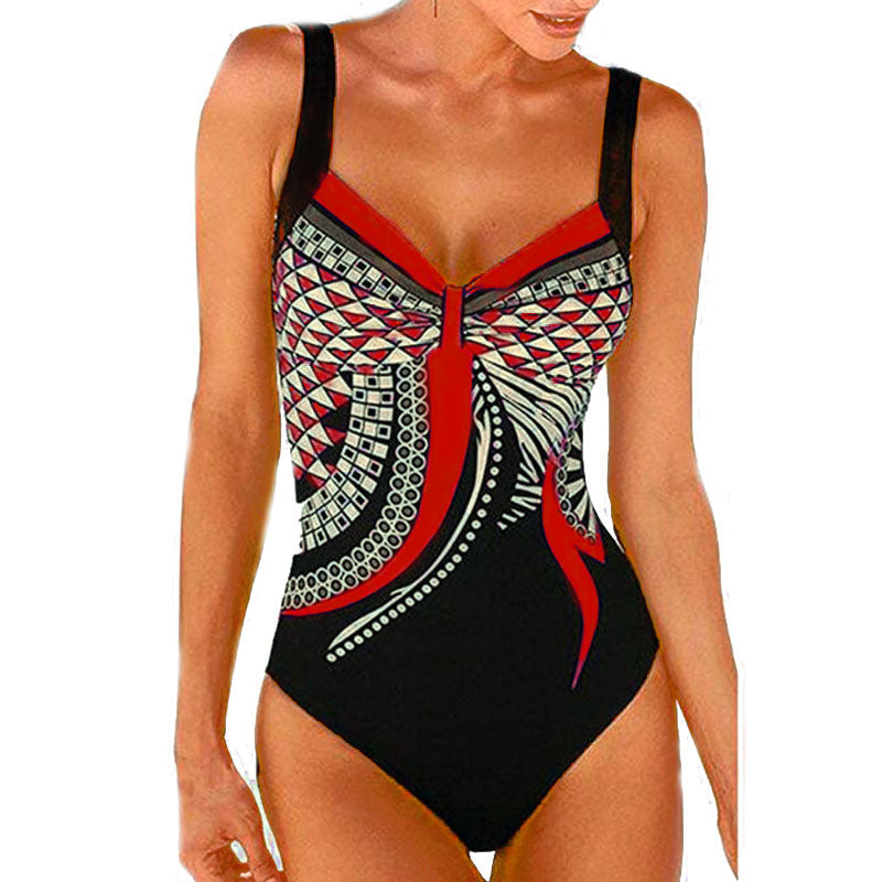 Black swimsuit with red and white geometric pattern on a white background
