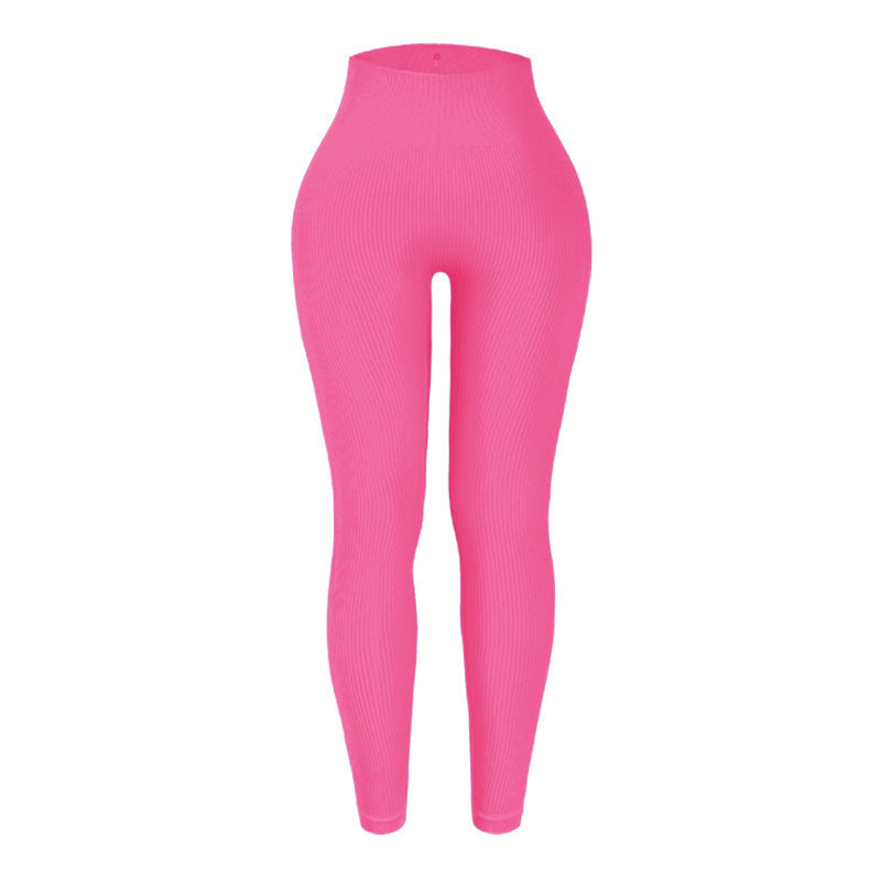 Bright pink leggings on a white background