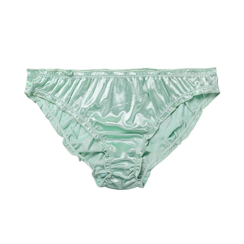 Mint green satin underwear with lace trim on a white background