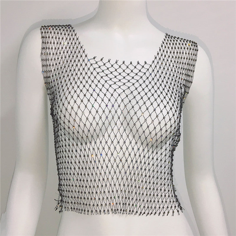Black fishnet top on a mannequin against a white background