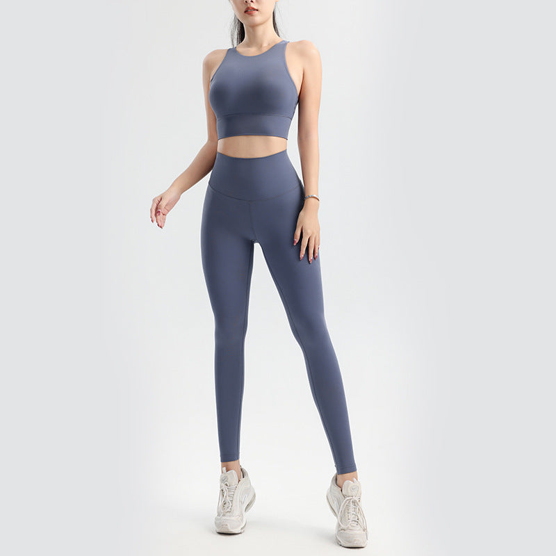 Person wearing a gray athletic outfit on a white background