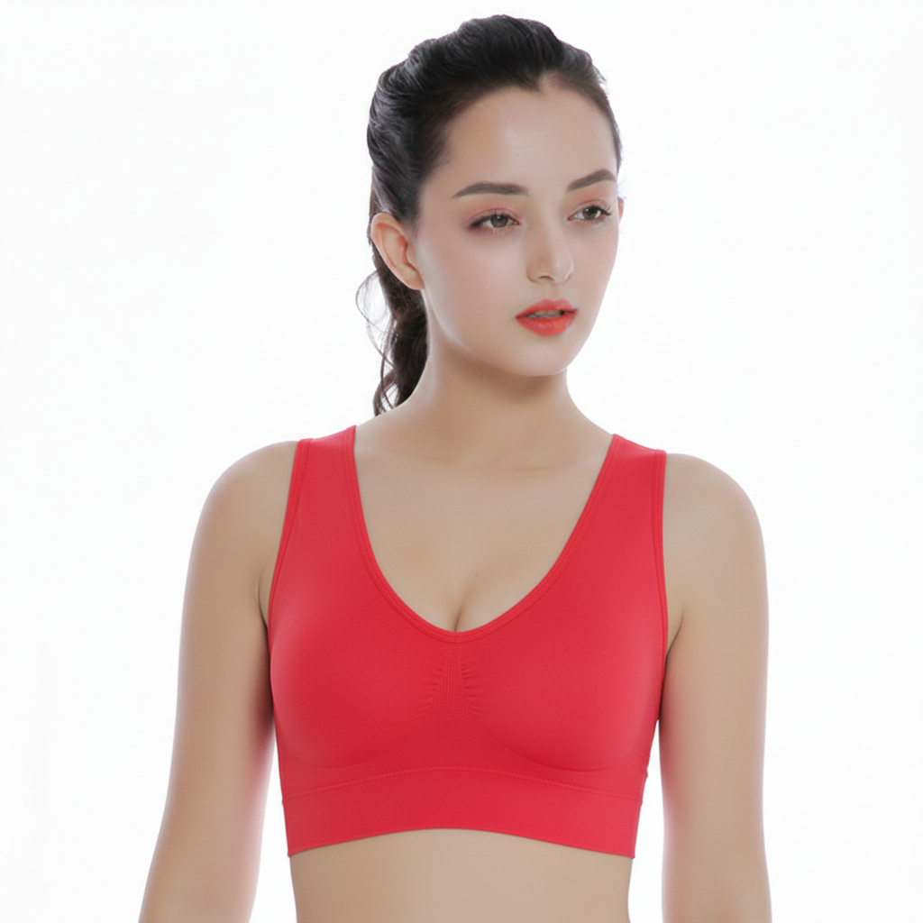 Woman wearing a red sports bra on a white background