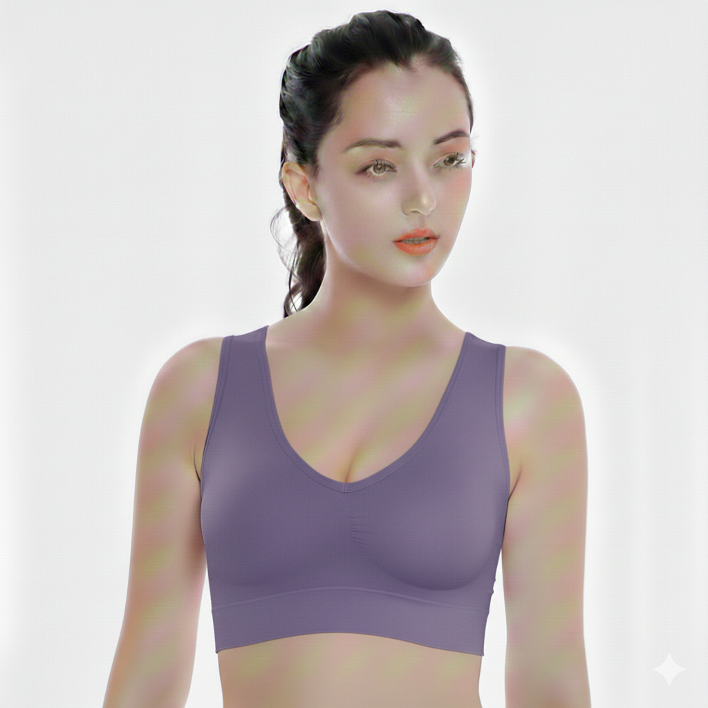 Woman wearing a purple sports bra against a white background