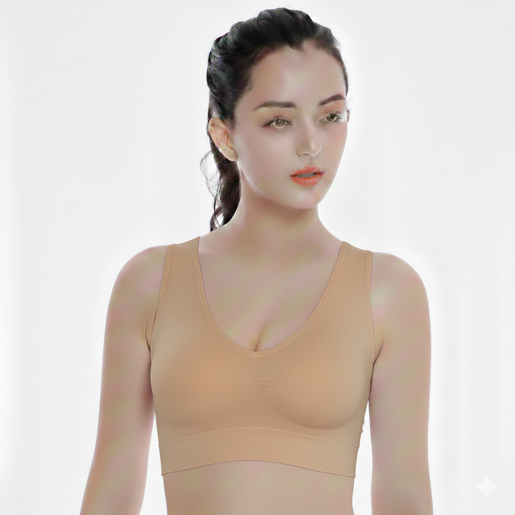 Woman wearing a beige bra on a white background