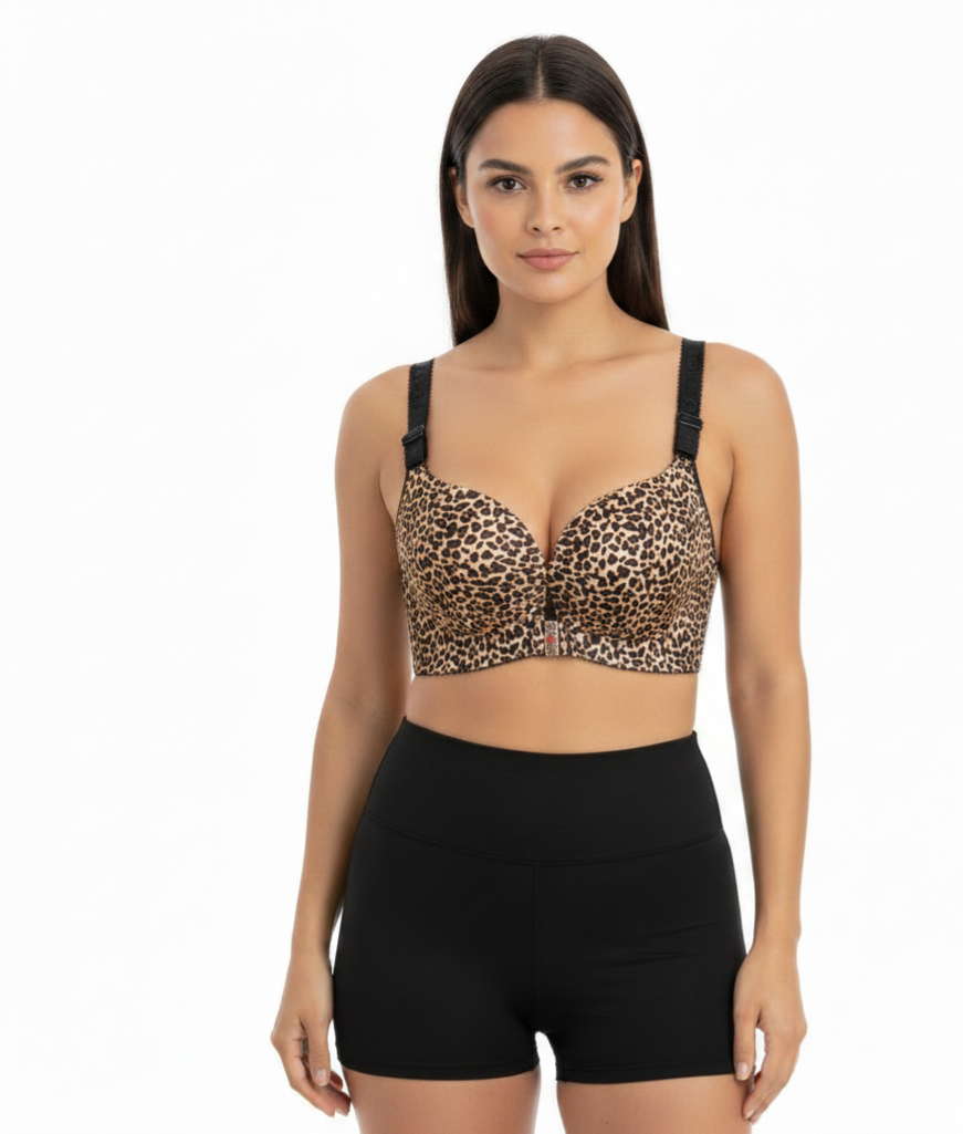 Woman wearing a leopard print bralette and black high-waisted shorts on a white background