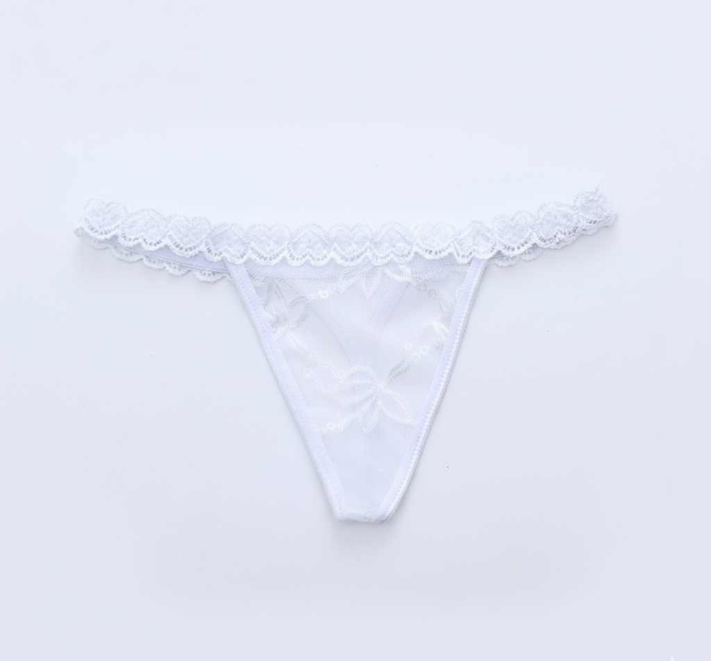 White lace thong on a light gray background