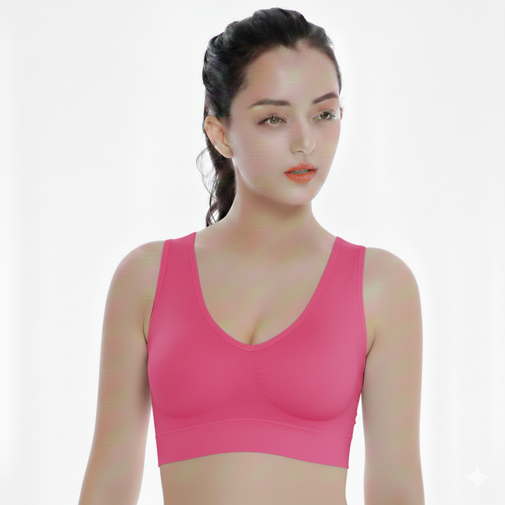 Woman wearing a pink sports bra against a white background