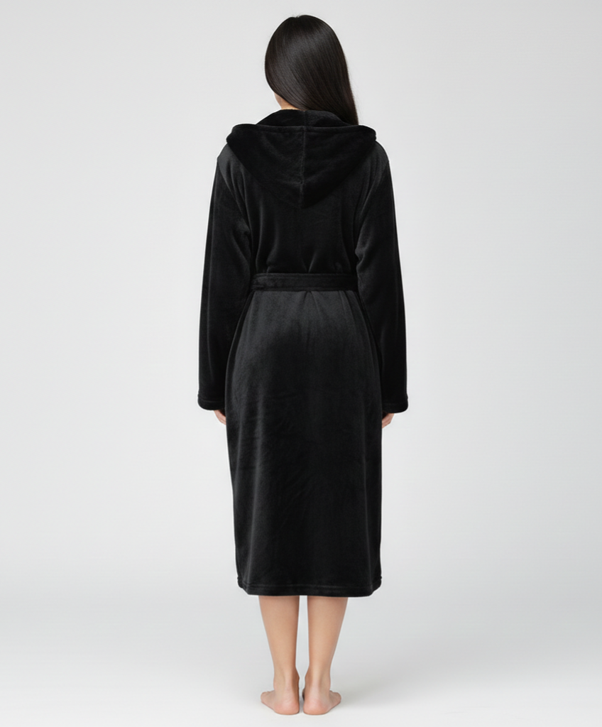 Person wearing a black robe with a hood on a white background