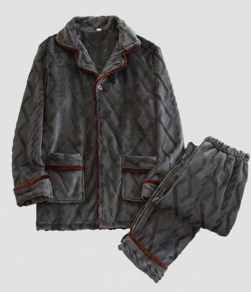 Gray quilted pajama set with brown trim on a light gray background