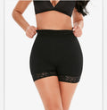 Black high-waisted shorts with lace trim worn by a person on a white background