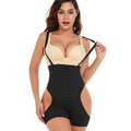 Woman wearing a black and beige shapewear garment on a white background