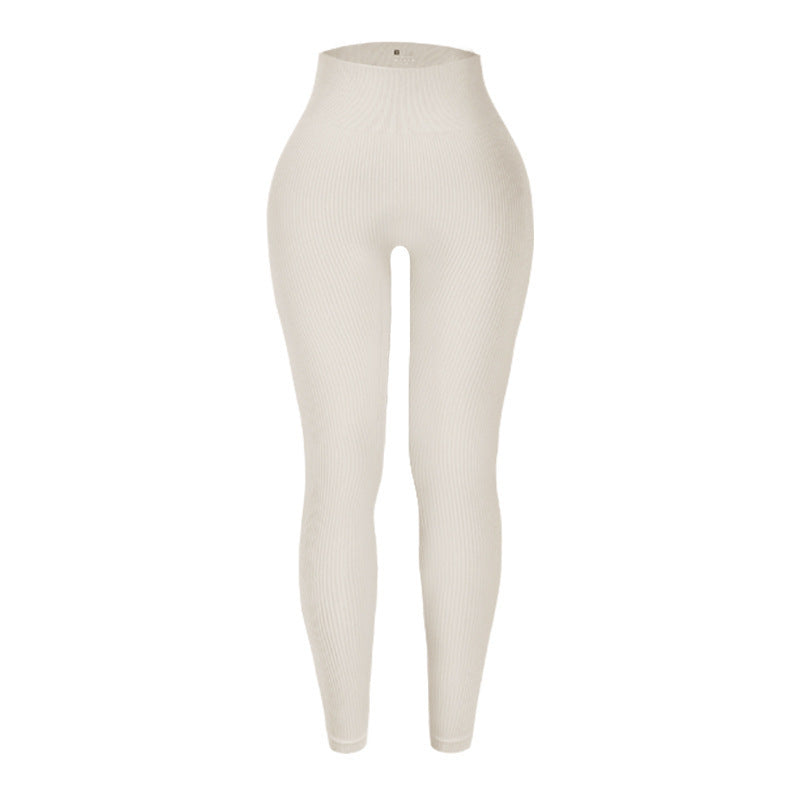 Beige leggings on a white background