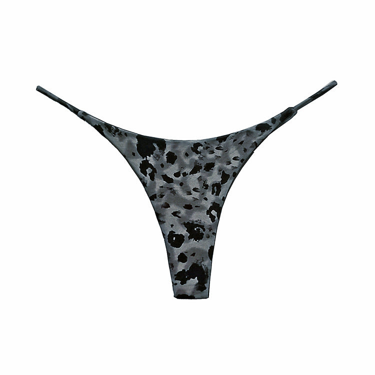 Gray thong with black abstract pattern on a white background