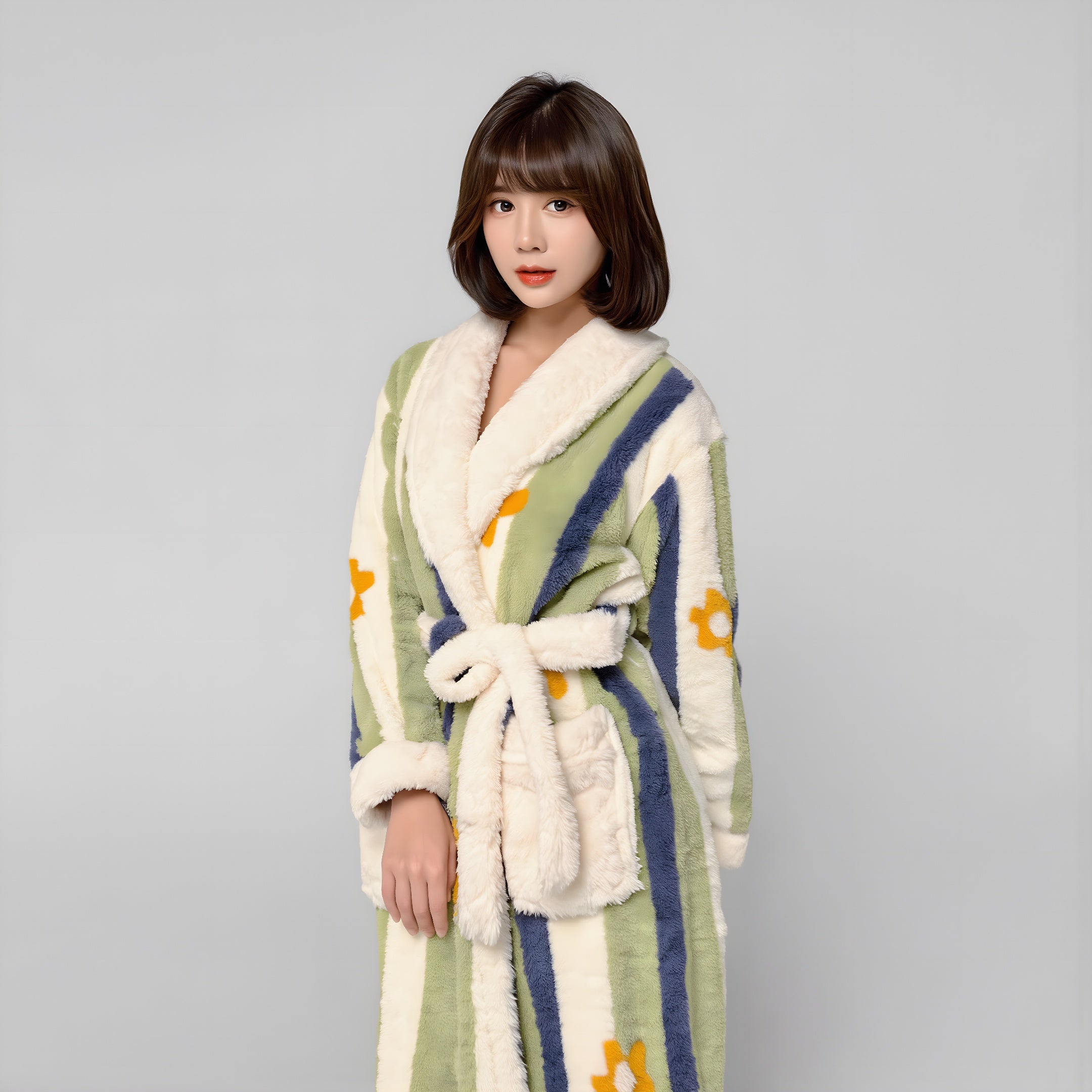 Woman wearing a patterned robe with a plain background