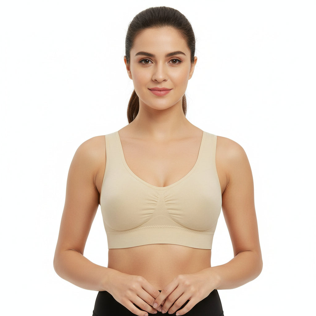 Woman wearing a beige sports bra on a white background