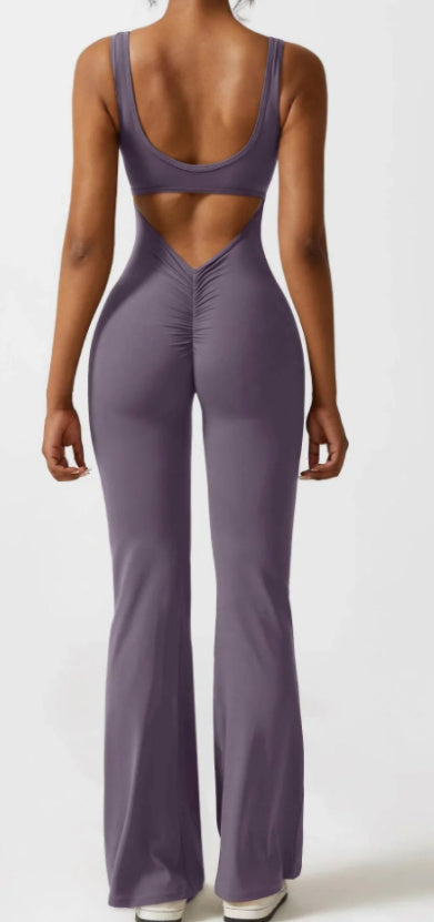 Purple jumpsuit with cut-out design on a white background