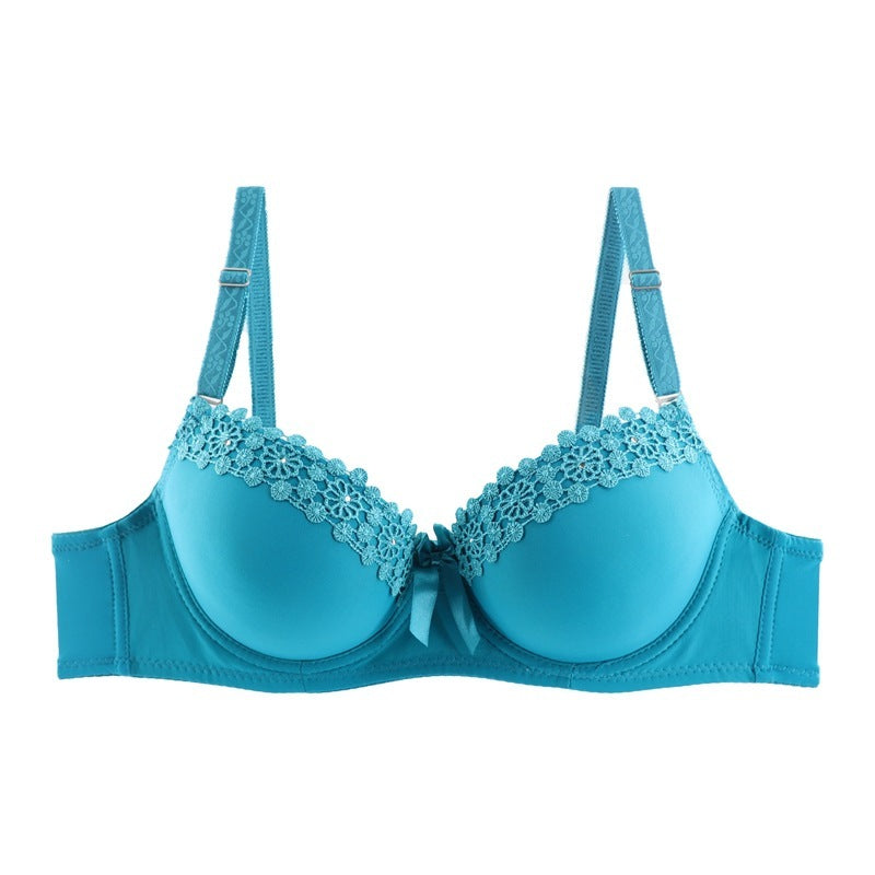 Blue bra with lace details on a white background